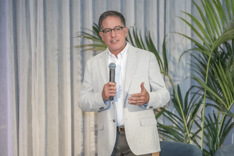 True Cycle Coaching head coach Joseph Lerner Speaking in front of a team building conference